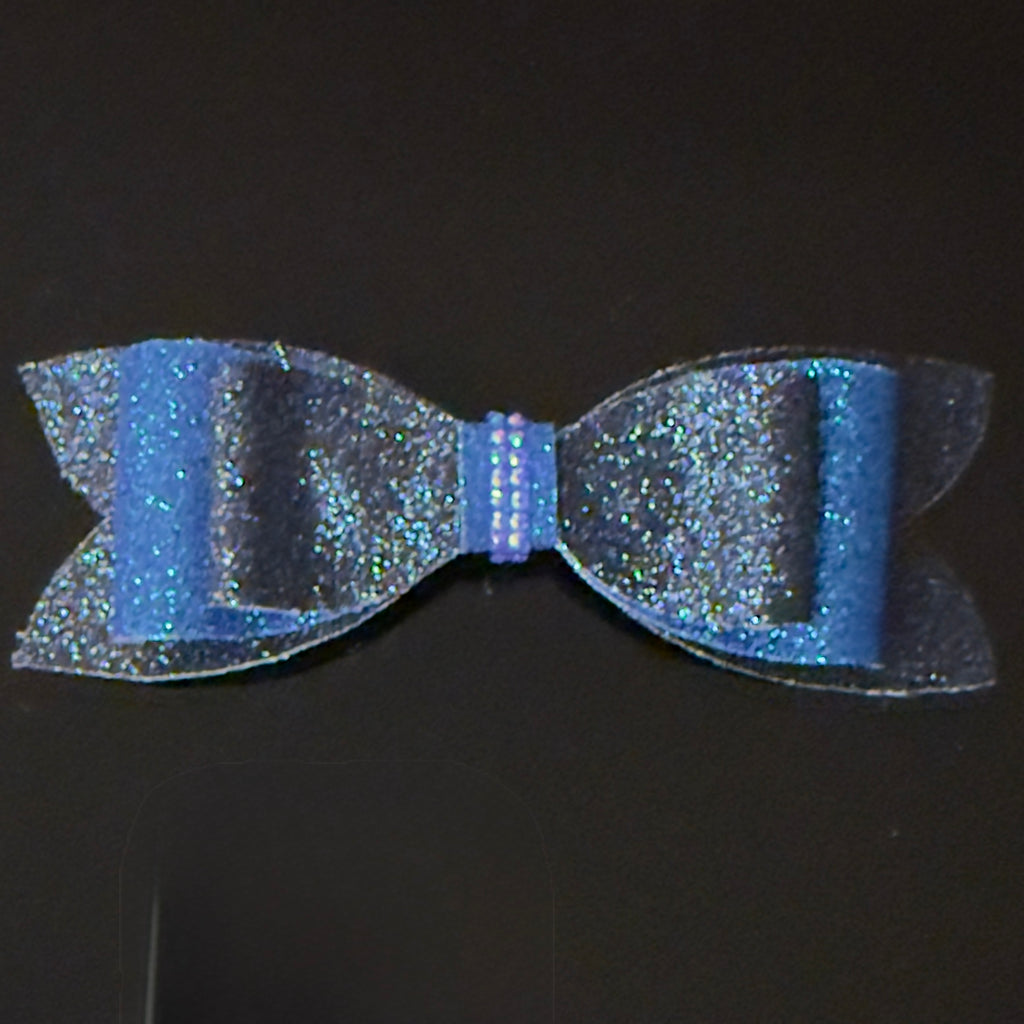 Blue glittery bow on a black background