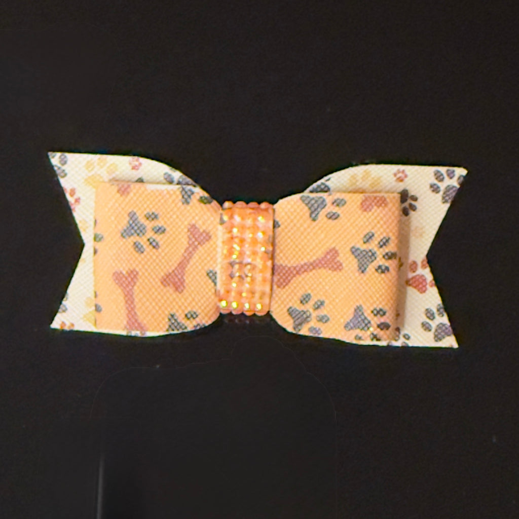Dog bow tie with bone pattern on a black background